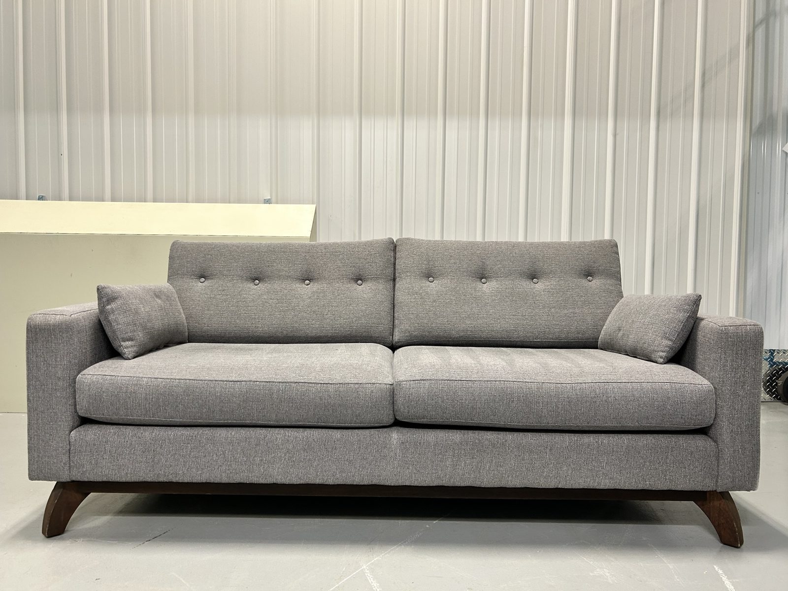 Urban Barn Grey Tufted Fabric Sofa Wood Base